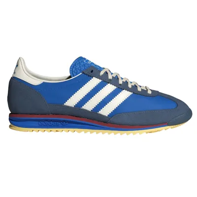 Blue and white Adidas sneakers featuring signature three stripes, a textured upper, and a layered sole with blue, red, and yellow accents.