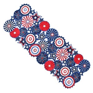 A table runner featuring a patriotic theme with red, white, and blue stars and circular patterns.