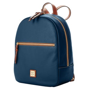 A blue leather backpack featuring a front zippered pocket, gold-tone hardware, and brown leather straps.