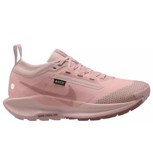 A pink athletic shoe featuring a Gore-Tex badge, a prominent brand logo on the side, designed for performance with a cushioned sole and lace-up closure.