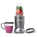 Nutribullet 600W Personal Blender, shown with a jar filled with fruits and nuts, includes a blending base, a tall cup, and a handled cup with a lid for making and serving smoothies easily.