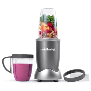 Nutribullet 600W Personal Blender, shown with a jar filled with fruits and nuts, includes a blending base, a tall cup, and a handled cup with a lid for making and serving smoothies easily.