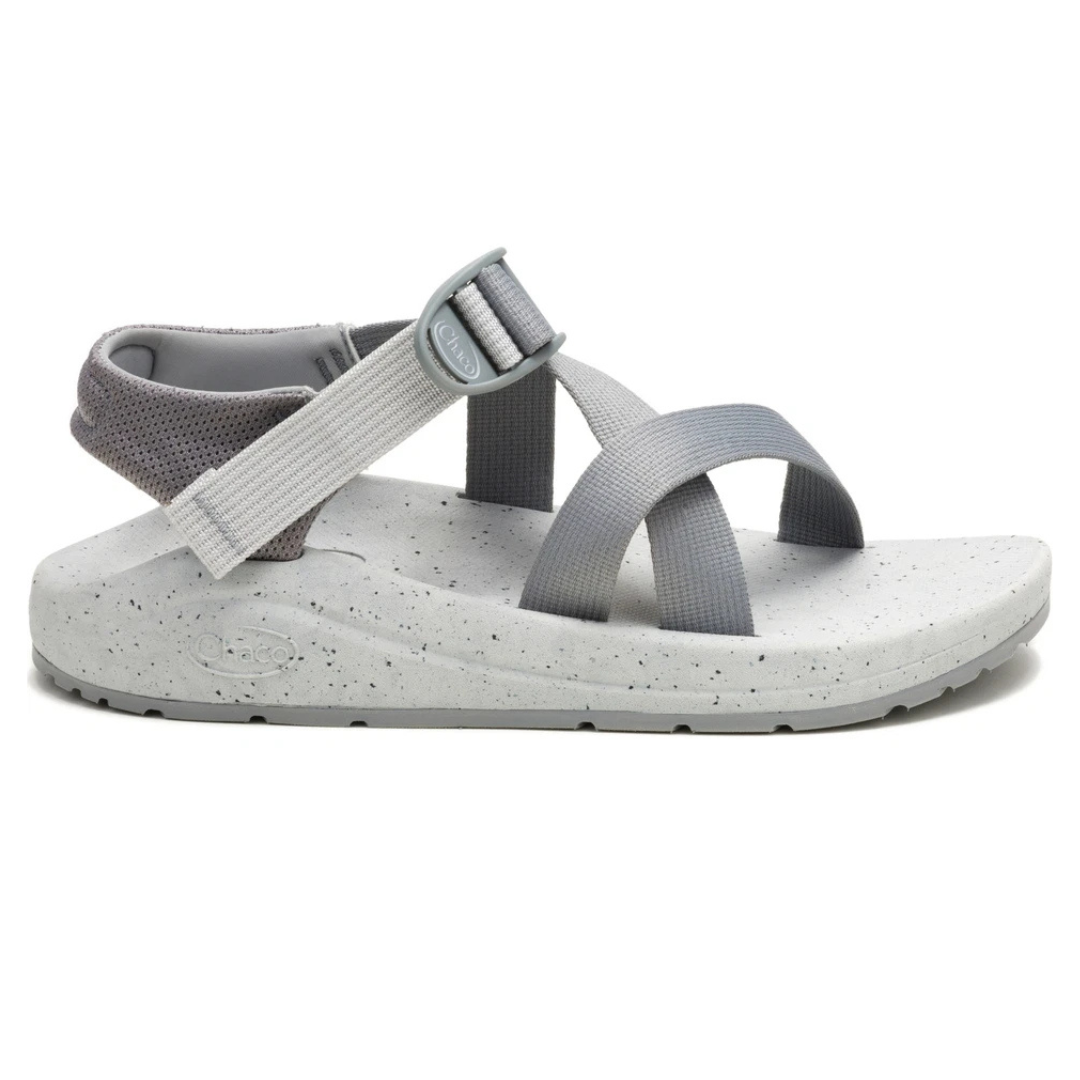 Gray sandal with adjustable straps, textured sole, and an ankle strap for support.