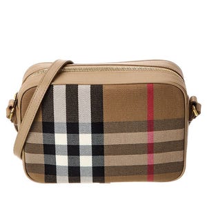 Burberry Canvas Check Crossbody Bag features the iconic check pattern with beige, black, and red accents. It has a rectangular shape, zip closure, and an adjustable strap for easy carrying.