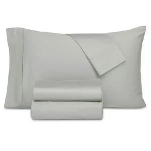 A light gray bedding set including a pillowcase, flat sheet, and folded fitted sheet.