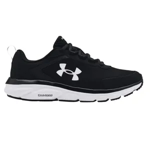 A black and white Under Armour athletic shoe with a logo on the side, featuring a cushioned sole labeled \“Charged\“ for enhanced support.