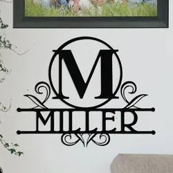 A wall decoration features a black monogram design with the letter \“M\“ in a circle and the word \“Miller\“ beneath, adorned with decorative swirls.