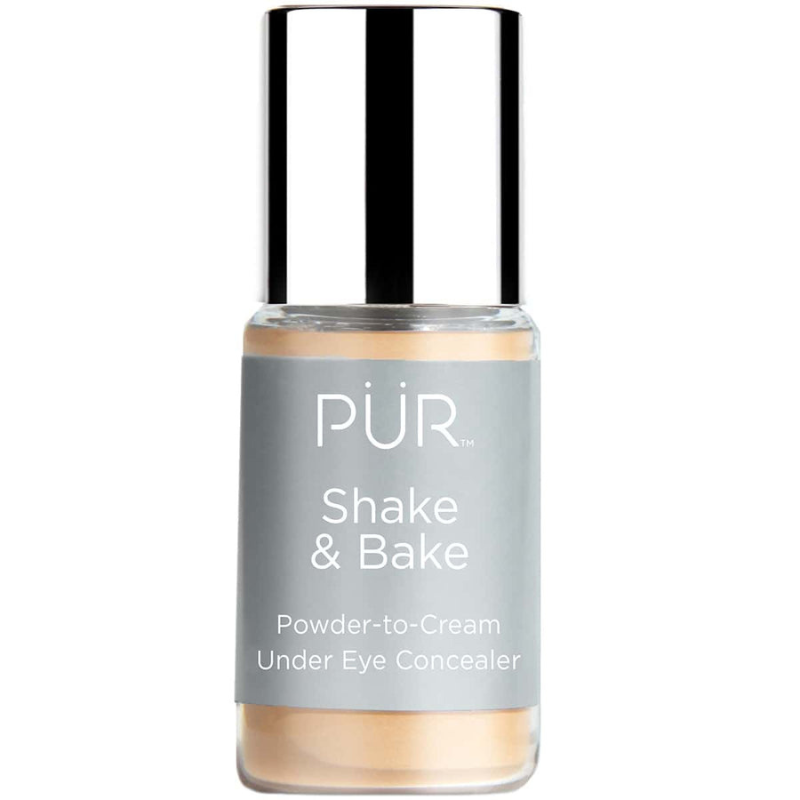 PÜR Shake & Bake is a powder-to-cream under eye concealer with a silver cap and gray label, designed to reduce the appearance of under-eye imperfections.