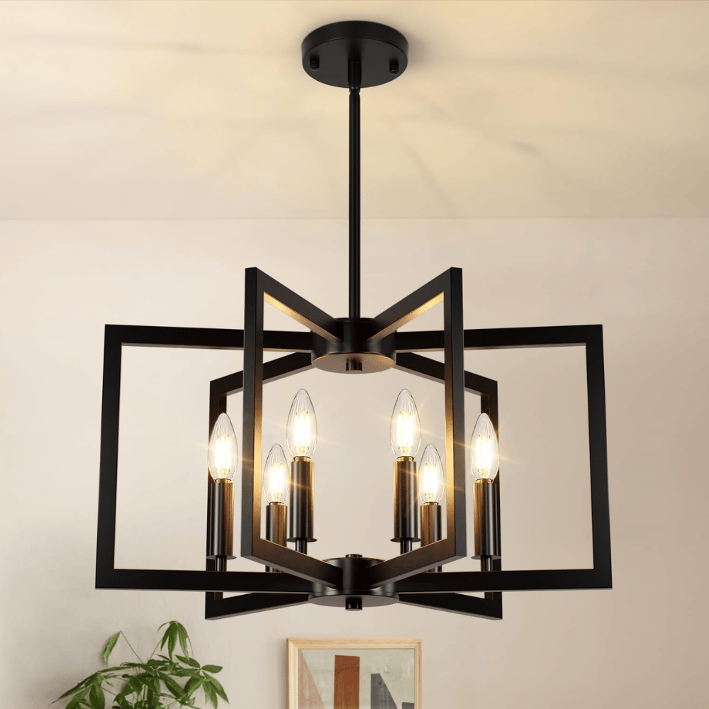 A modern black geometric chandelier with six candle-style bulbs in a metal frame, hanging from a ceiling, adds a contemporary touch to the room.