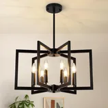 A modern black geometric chandelier with six candle-style bulbs in a metal frame, hanging from a ceiling, adds a contemporary touch to the room.