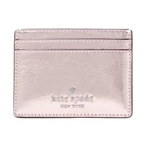 A metallic pink Kate Spade New York cardholder with two card slots and embossed branding.