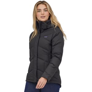 The Patagonia Down With It Jacket is a black, insulated women's jacket featuring a high collar and quilted design, ideal for cold weather. It has waist-length coverage and is made for warmth and comfort.