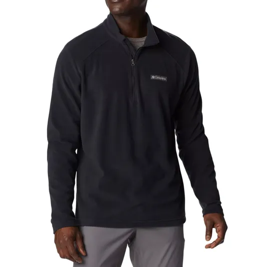 A man wearing a black quarter-zip fleece pullover with a logo on the chest.
