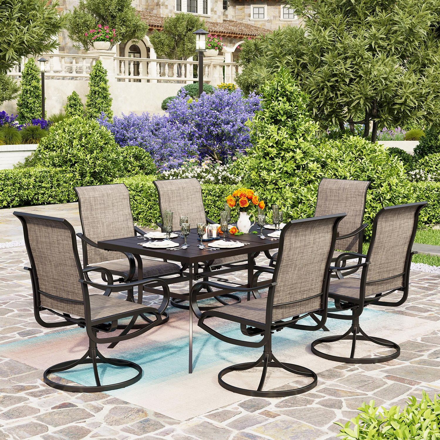 An outdoor dining set with six chairs and a rectangular table, set on a patio with a table setting and surrounded by lush plants.