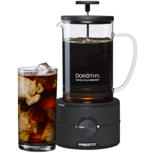 Dorothy Rapid Cold Brewer by Presto with a glass of brewed coffee and cream.