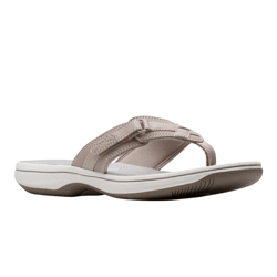 A beige flip-flop sandal with a cushioned sole and textured grip, featuring adjustable straps with stitching details.