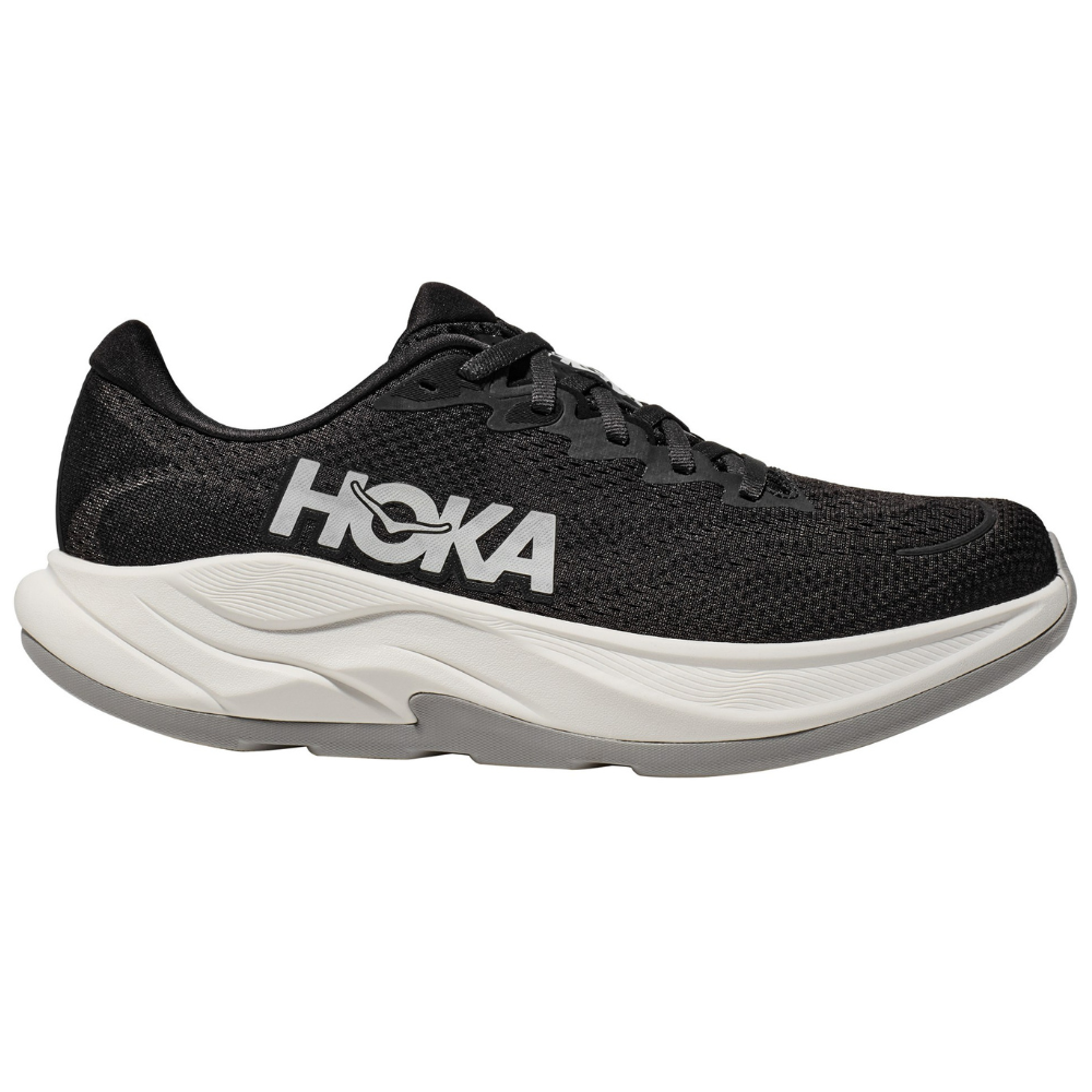 A black Hoka running shoe with a white midsole and \“HOKA\“ logo on the side.