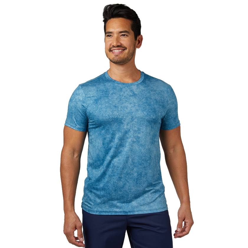 A blue crew-neck short-sleeve t-shirt made of a soft, comfortable fabric with a subtle printed texture.