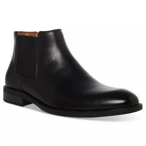 Black leather Chelsea boot with elastic side panels and a low heel.