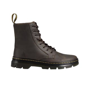A brown leather lace-up boot with a rugged sole and a yellow-stitched welt, featuring a distinctive pull tab at the heel.