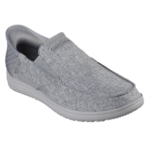 Gray slip-on shoe with a textured fabric design, labeled \“Skechers\“ on the top and sides.