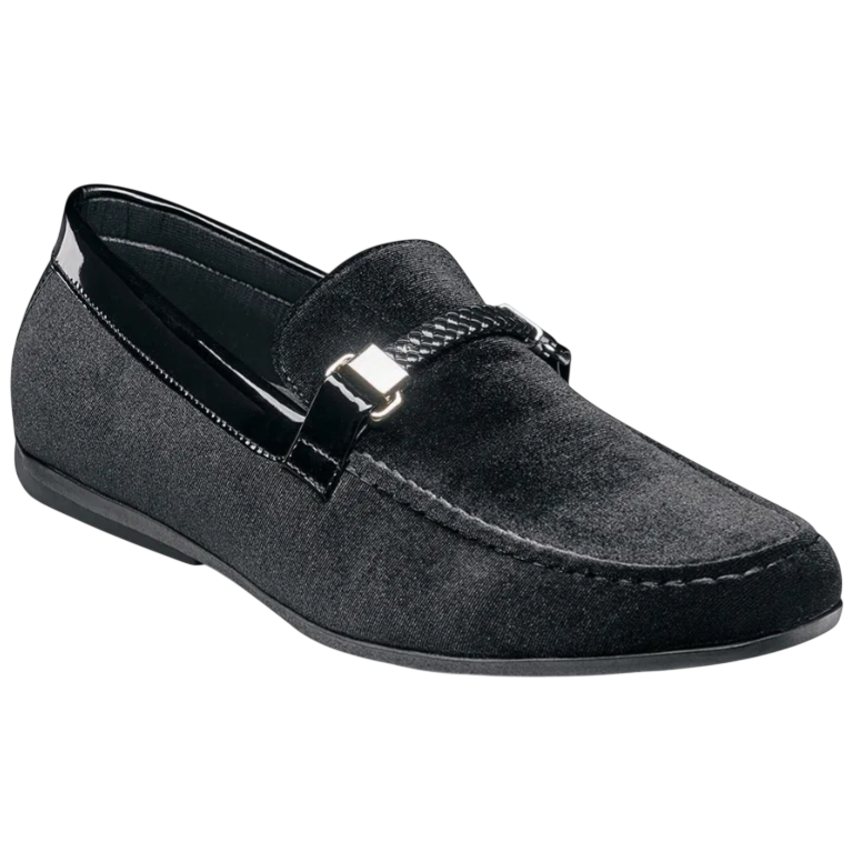 A black velvet loafer with a sleek design, featuring a decorative metallic buckle and braided detail across the front.