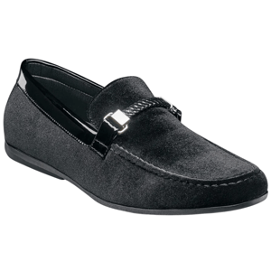 A black velvet loafer with a sleek design, featuring a decorative metallic buckle and braided detail across the front.