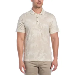 A light beige polo shirt with a tonal palm tree pattern, short sleeves, and a buttoned collar, paired with beige pants.