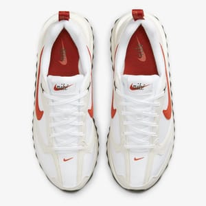 A pair of white and red sneakers with the Nike logo are shown from a top-down perspective.