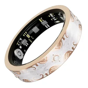 A smart ring featuring intricate designs with inner electronics visible, likely for health monitoring or fitness tracking.