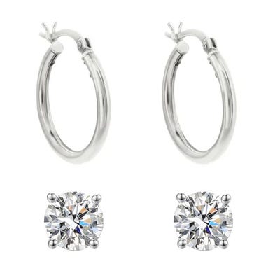 A pair of silver hoop earrings and two round-cut diamond stud earrings.