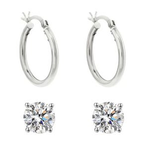 A pair of silver hoop earrings and two round-cut diamond stud earrings.