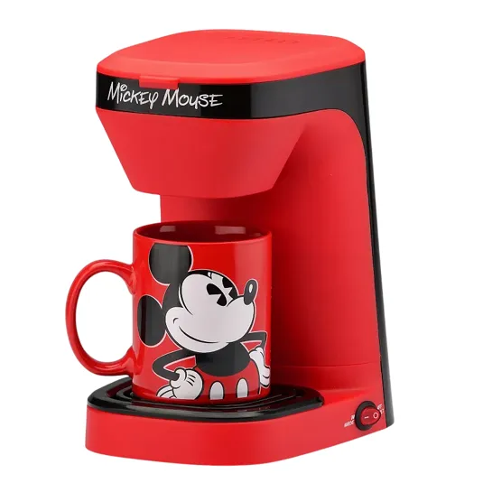 Red Mickey Mouse-themed single-serve coffee maker with an included red mug featuring a Mickey Mouse design.