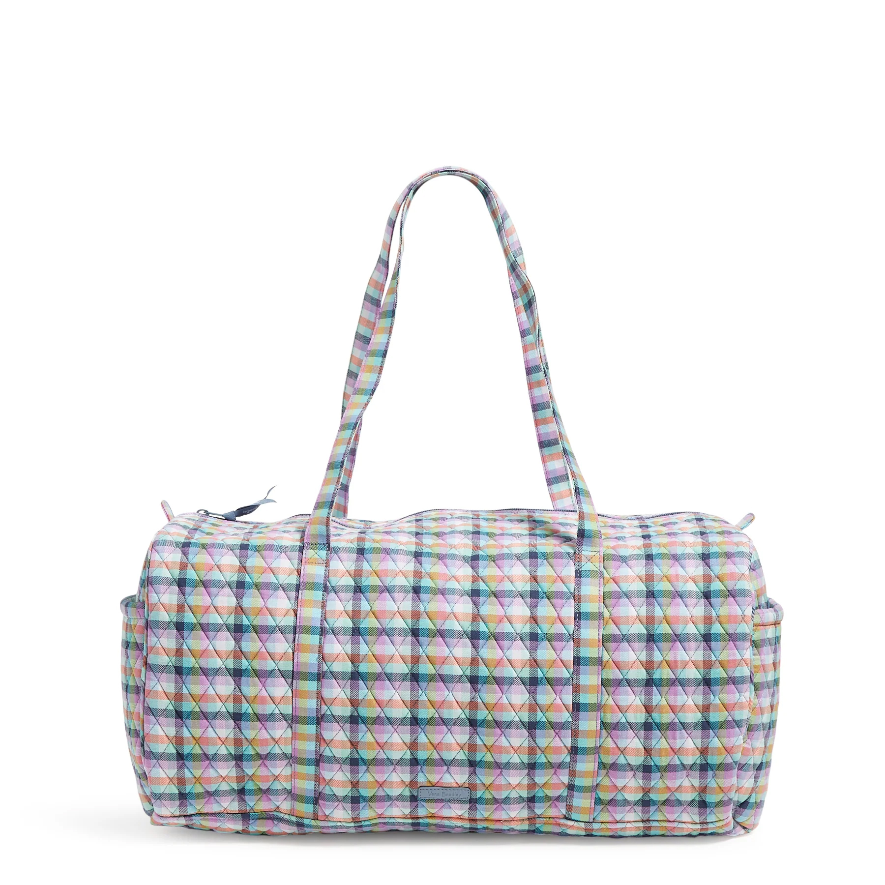 A duffel bag with a multicolored checkered pattern, featuring two handles and a rounded body shape.
