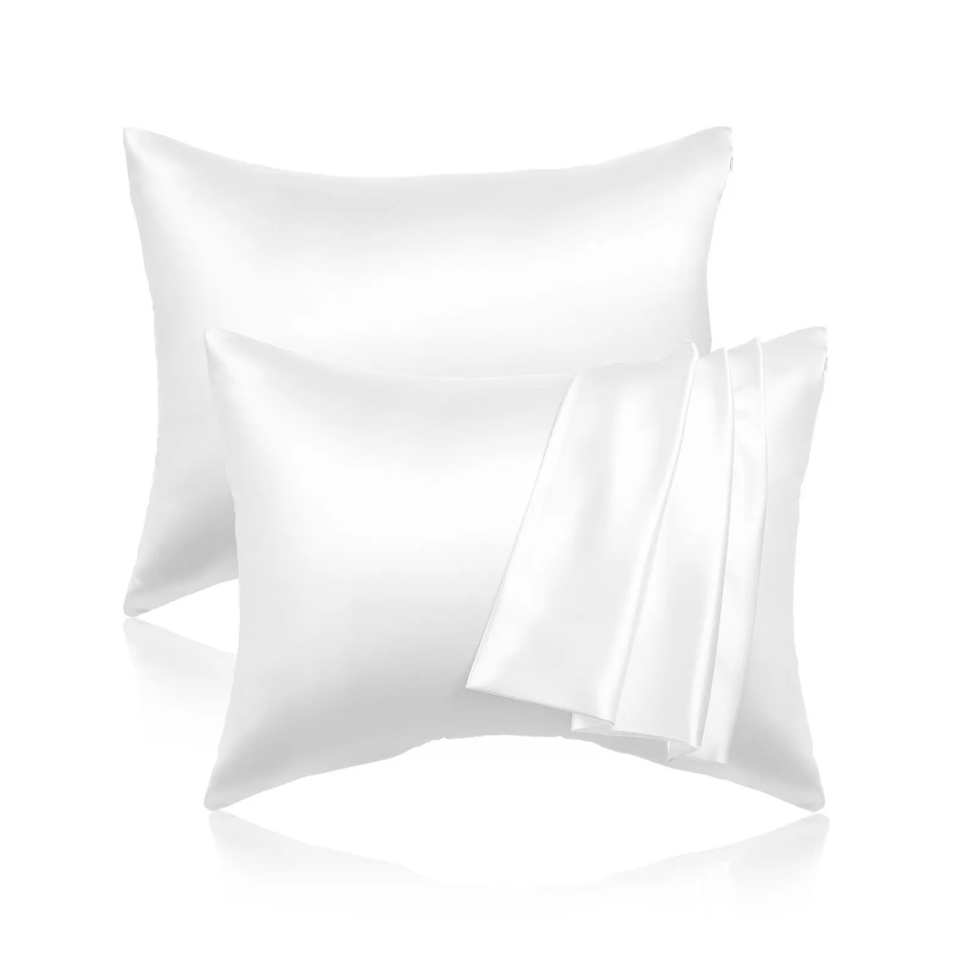 Two white satin pillowcases with a smooth, glossy texture.