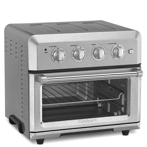 A stainless steel Cuisinart air fryer toaster oven with a transparent door and four control knobs for power, temperature, function, and timer settings.