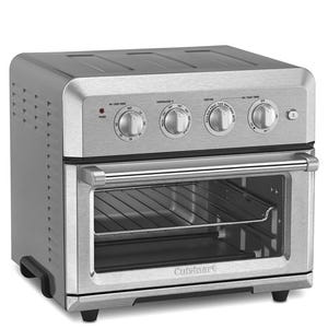 A stainless steel Cuisinart air fryer toaster oven with a transparent door and four control knobs for power, temperature, function, and timer settings.