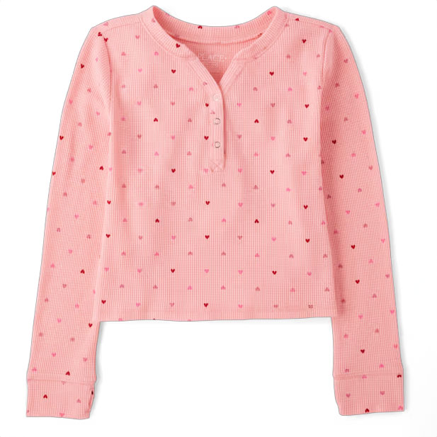A pink, long-sleeved henley thermal top with a waffle texture and small heart patterns throughout.