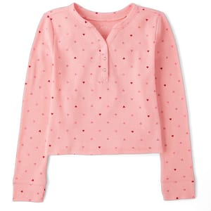 A pink, long-sleeved henley thermal top with a waffle texture and small heart patterns throughout.