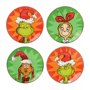A set of four round plates featuring characters from \“How the Grinch Stole Christmas,\“ including the Grinch, Cindy Lou Who, and Max the dog, each with festive red and green backgrounds.