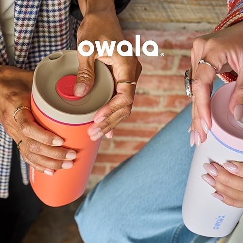 Two people holding Owala brand water bottles, one orange and one light blue, each with a flip-top lid.