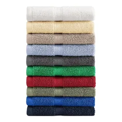 A stack of Tommy Hilfiger bath towels in a variety of colors: white, cream, beige, light blue, grey, dark grey, green, red, olive, blue, and navy.