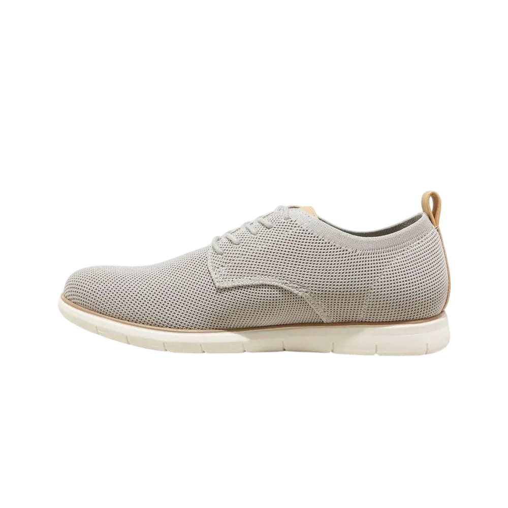 A gray mesh-knit sneaker with a white cushioned sole and brown pull tab, featuring a sleek, modern design.