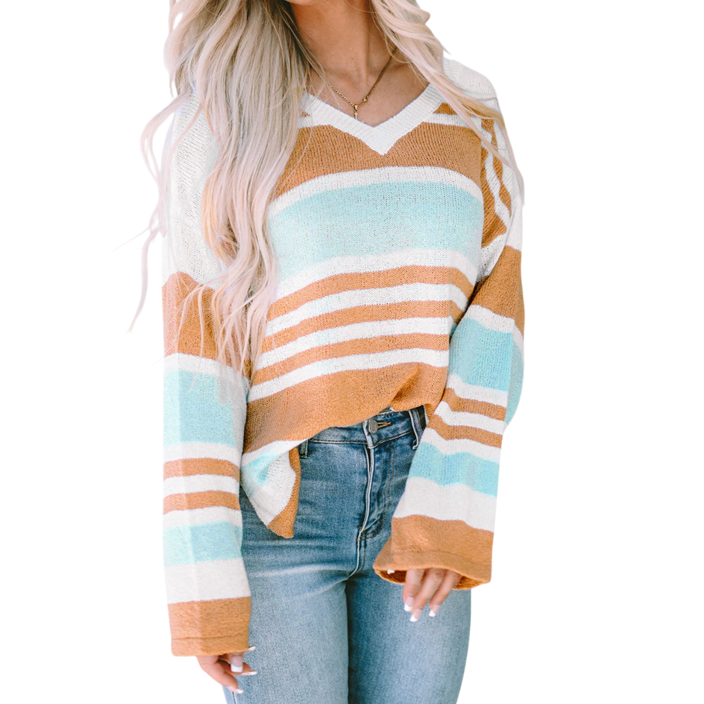 A woman wearing a striped V-neck sweater in pastel blue, white, and brown, paired with high-waisted jeans.