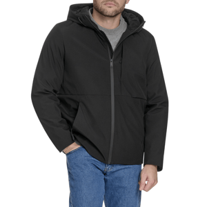 A man is wearing a black hooded jacket with a front zipper over a gray T-shirt, paired with blue jeans.