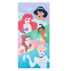 A towel featuring illustrations of animated princess characters, including ones in purple, yellow, and blue gowns, with a colorful geometric background.
