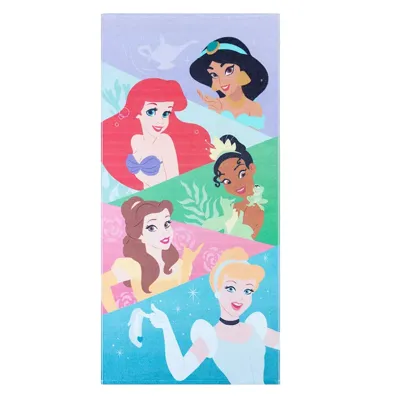 A towel featuring illustrations of animated princess characters, including ones in purple, yellow, and blue gowns, with a colorful geometric background.