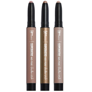 The 3pc Waterproof Eyeshadow Stick Trio includes three cream eyeshadow sticks labeled \“Superhero No-Tug\“ by IT Cosmetics, featuring shades in neutral tones with a twist-up design suitable for easy, smooth application.