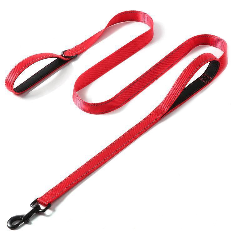 A red nylon dog leash with two loops for handles and a metal clasp at the end.