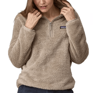 The Patagonia Los Gatos Pullover is a plush, tan fleece with a half-zip front and a small chest logo, offering a cozy and casual style.